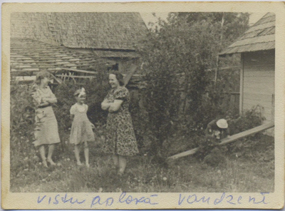 people standing in chook yard